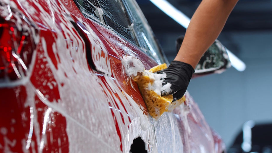 auto-cleaning-service-man-worker-cleaning-the-car-2022-08-04-19-20-33-utc